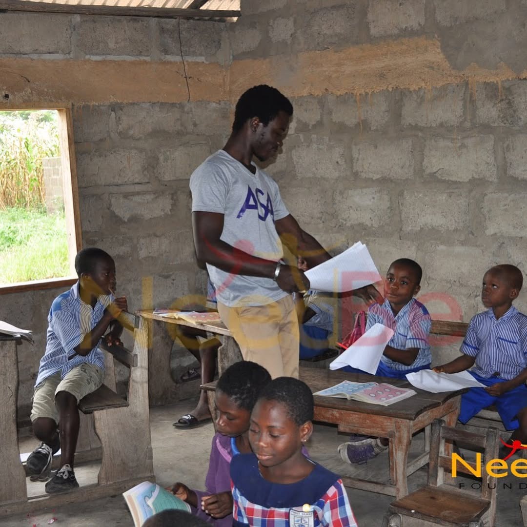 Volunteers smiling in partner classrooms